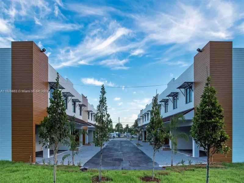 Front exterior of a new home in , Homestead, FL, highlighting curb appeal (Image 1). Front exterior of a new home in , Homestead, FL, highlighting curb appeal (Image 1).