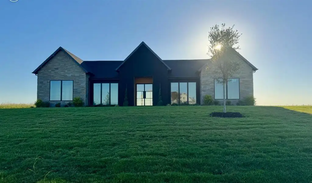 Front exterior of a new home in , Venus, TX, highlighting curb appeal (Image 2).