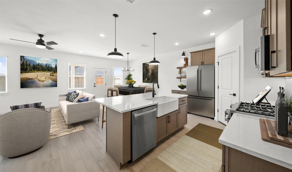 Kitchen overlooks great room and dining area Kitchen overlooks great room and dining area