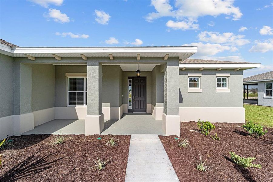 Exterior details and patio area of a home in On Top of the World Communities, Ocala (Image 4).