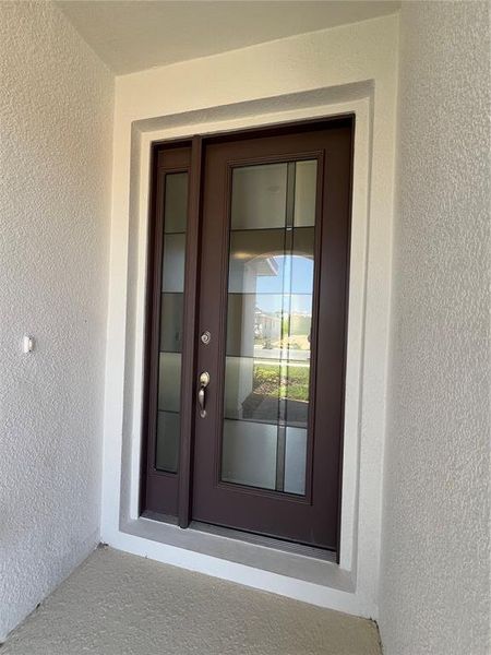 Exterior details and patio area of a home in Hills of Minneola, Minneola (Image 3).