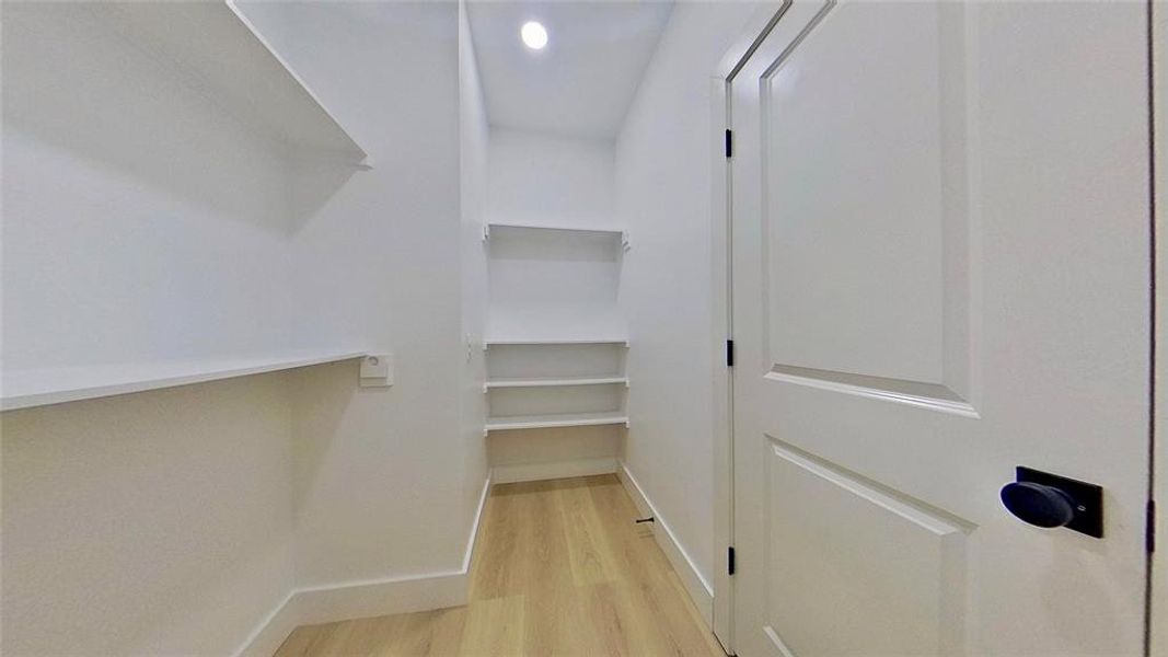 Brightly lit interior space featuring light wood-finish flooring