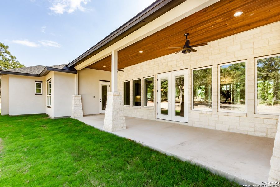 Front exterior of a new home in , La Vernia, TX, highlighting curb appeal (Image 23).