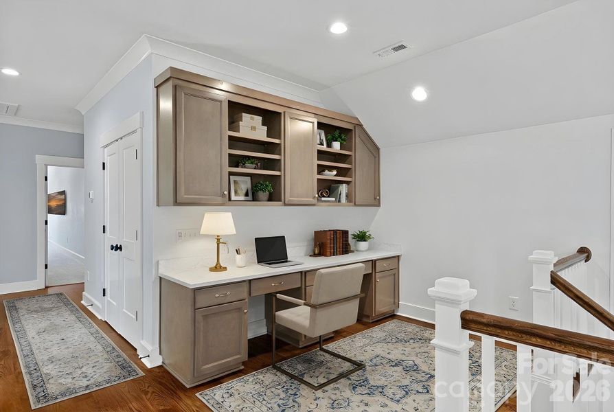 Upper level loft area with built-ins Upper level loft area with built-ins