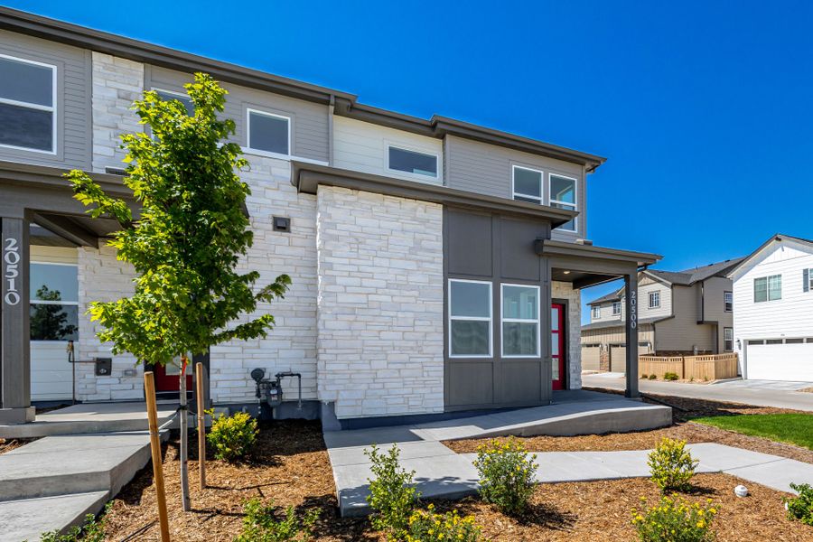 Front exterior of a new home in Painted Prairie, Aurora, CO, highlighting curb appeal (Image 22). Front exterior of a new home in Painted Prairie, Aurora, CO, highlighting curb appeal (Image 22).