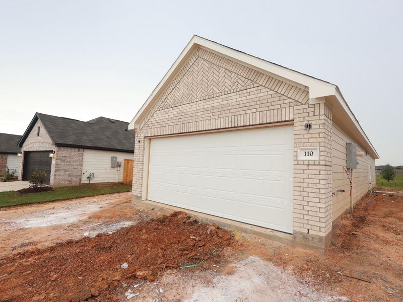 Front exterior of a new home in Magnolia Ridge, Magnolia, TX, highlighting curb appeal (Image 13). Front exterior of a new home in Magnolia Ridge, Magnolia, TX, highlighting curb appeal (Image 13).