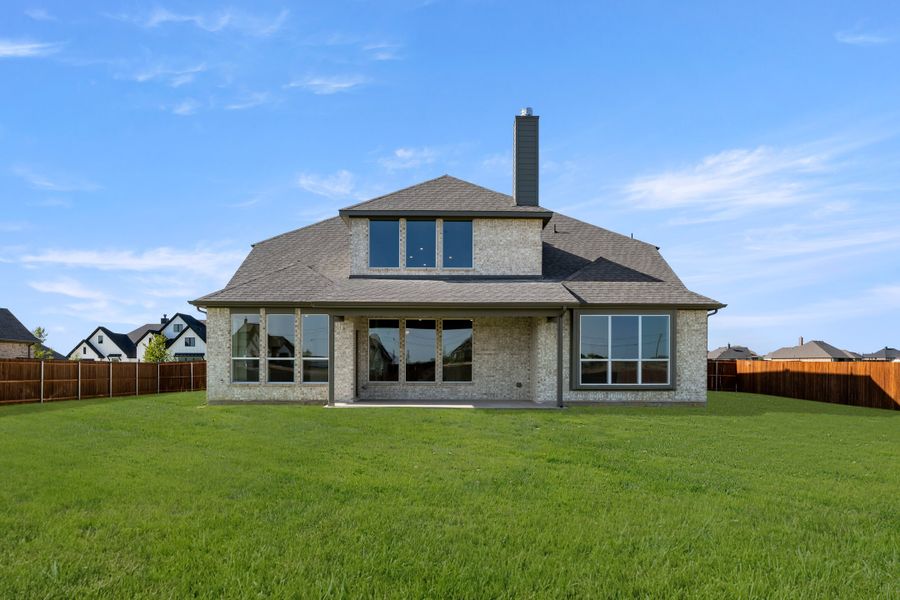Exterior details and patio area of a home in Coyote Crossing, Godley (Image 4).