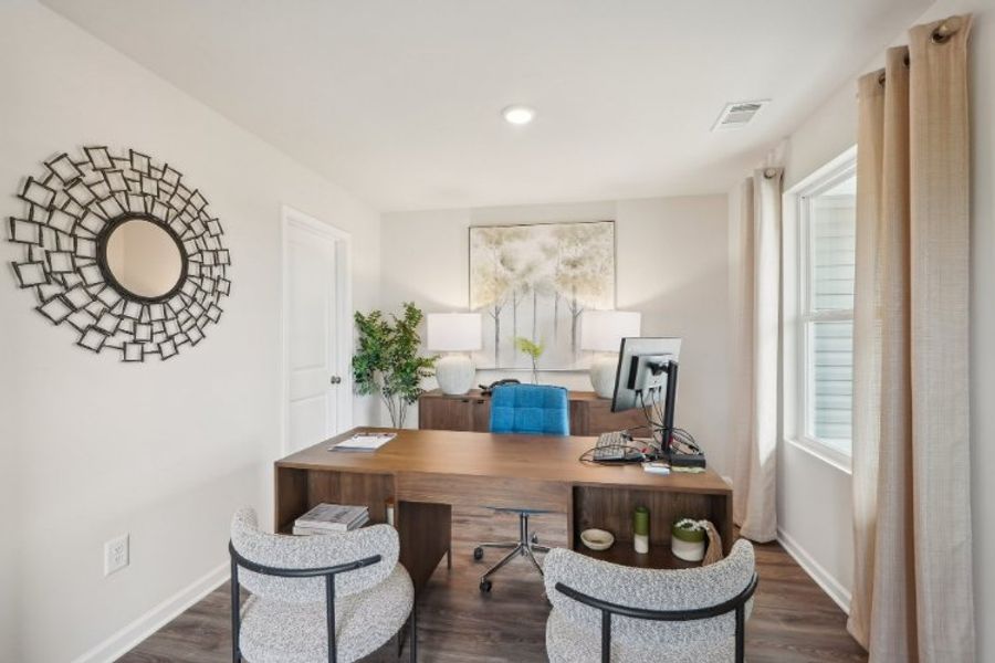 A room with a desk and chairs. A room with a desk and chairs.