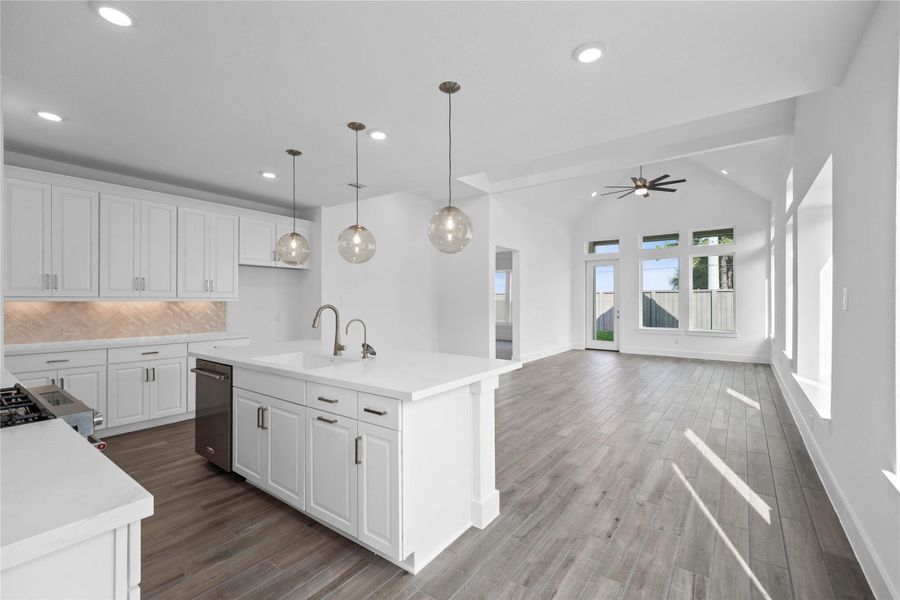 Stunning open-concept design seamlessly connecting the living, dining, and kitchen areas—perfect for both everyday living and entertaining!