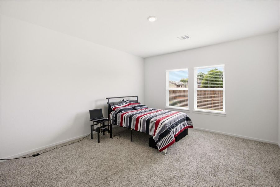 Primary bedroom view — Bright owner’s retreat with clean, neutral design. Primary bedroom view — Bright owner’s retreat with clean, neutral design.