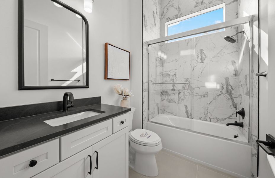Representative furnished interior of a home built from the Layton Grande by DiVosta in BeachWalk by Manasota Key, Englewood (Image 11).