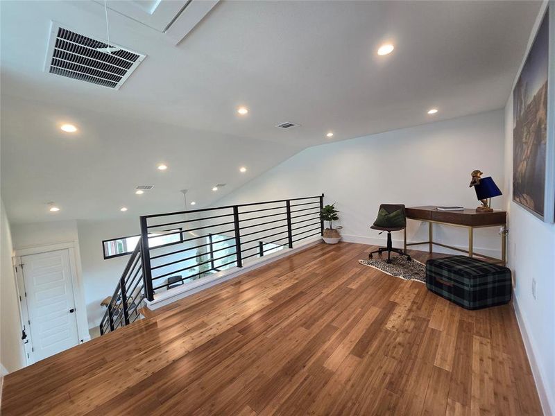 Open loft with a view of the living space below.