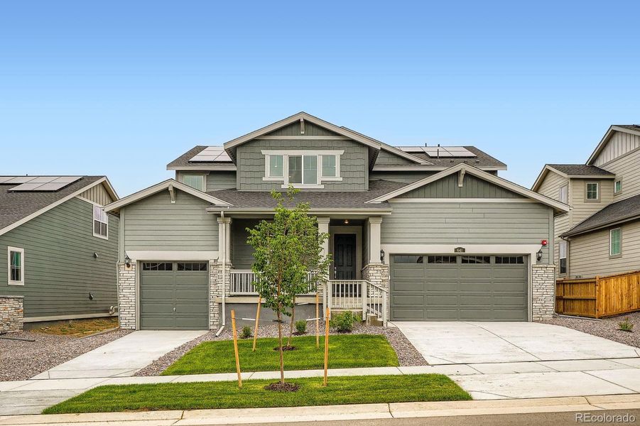 Front exterior of a new home in Sunset Village: The Grand Collection, Erie, CO, highlighting curb appeal (Image 1). Front exterior of a new home in Sunset Village: The Grand Collection, Erie, CO, highlighting curb appeal (Image 1).