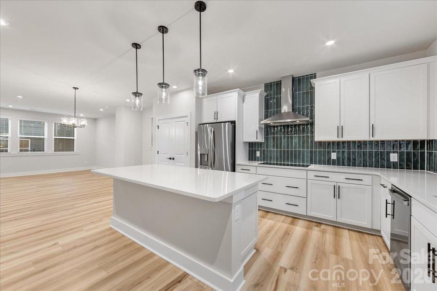 Striking White Cabinets and Quartz Countertops.