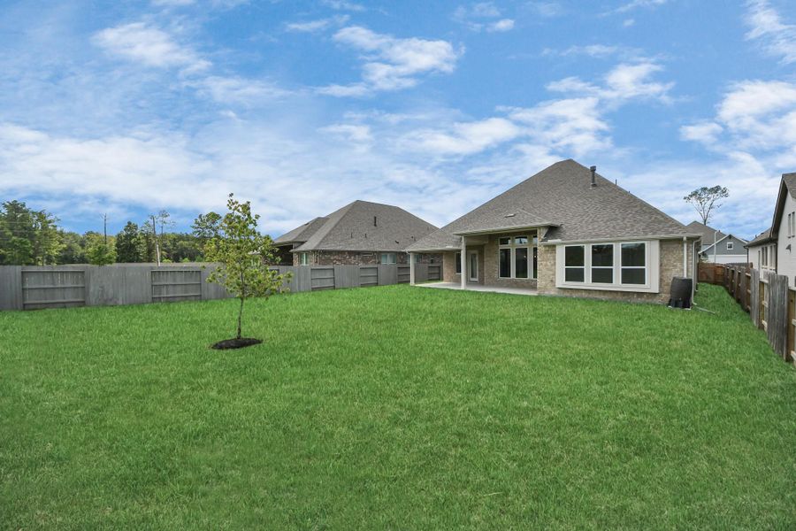 Front exterior of a new home in ARTAVIA: Hilltop Collection, Conroe, TX, highlighting curb appeal (Image 26). Front exterior of a new home in ARTAVIA: Hilltop Collection, Conroe, TX, highlighting curb appeal (Image 26).