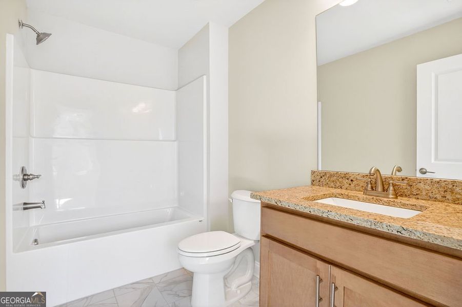 Furnished interior view inside a new home in Stone Brooke, Gray (Image 6).