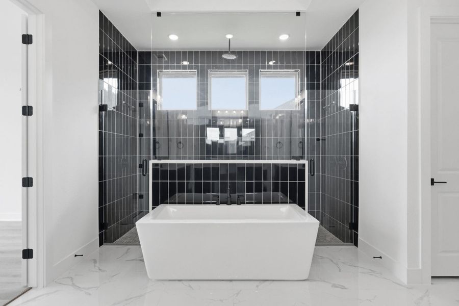 Primary en-suite with separate walk-in shower and tub
