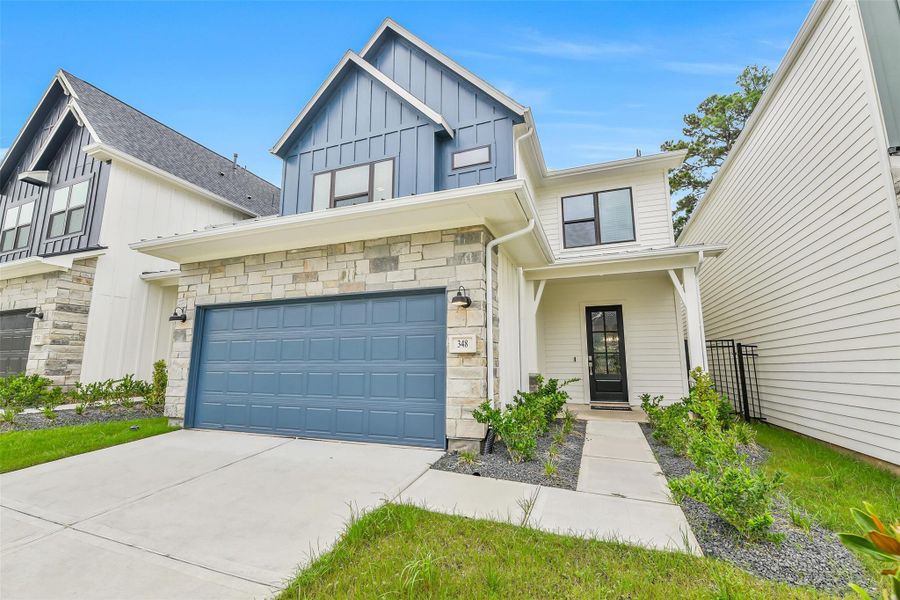 Front exterior of a new home in Summer Place  35', Montgomery, TX, highlighting curb appeal (Image 29).