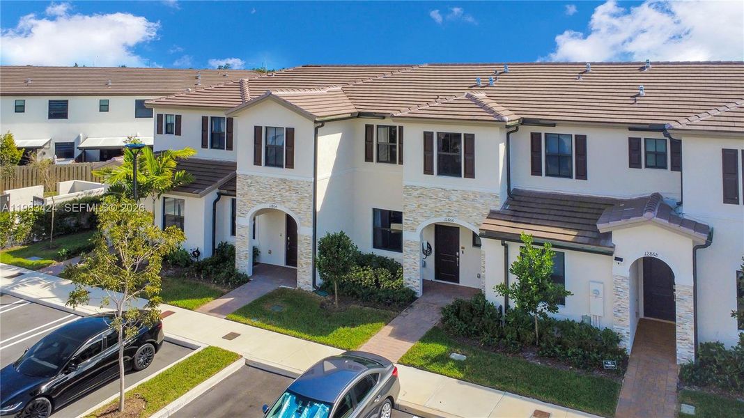 Front exterior of a new home in , Homestead, FL, highlighting curb appeal (Image 21). Front exterior of a new home in , Homestead, FL, highlighting curb appeal (Image 21).