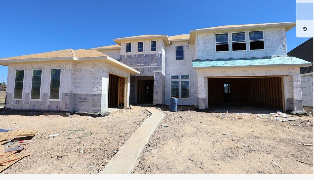 Exterior details and patio area of a home in Woodson’s Reserve 70′, Spring (Image 2).