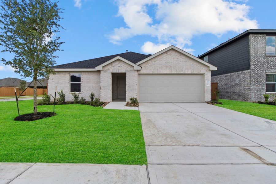Front exterior of a new home in Cypress Green, Hockley, TX, highlighting curb appeal (Image 1). Front exterior of a new home in Cypress Green, Hockley, TX, highlighting curb appeal (Image 1).