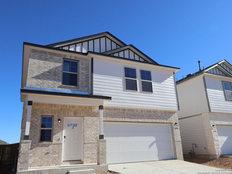 Front exterior of a new home in Winding Brook, San Antonio, TX, highlighting curb appeal (Image 2). Front exterior of a new home in Winding Brook, San Antonio, TX, highlighting curb appeal (Image 2).