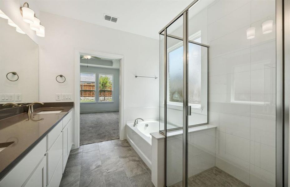 Owner's bath with large shower*real home pictured