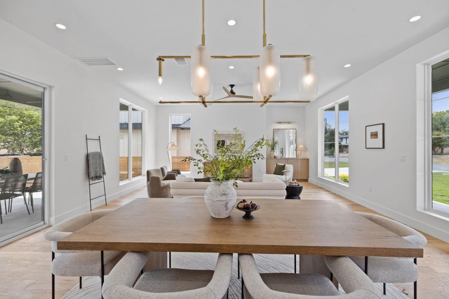 Dining space featuring light wood-style floors and recessed lighting Dining space featuring light wood-style floors and recessed lighting