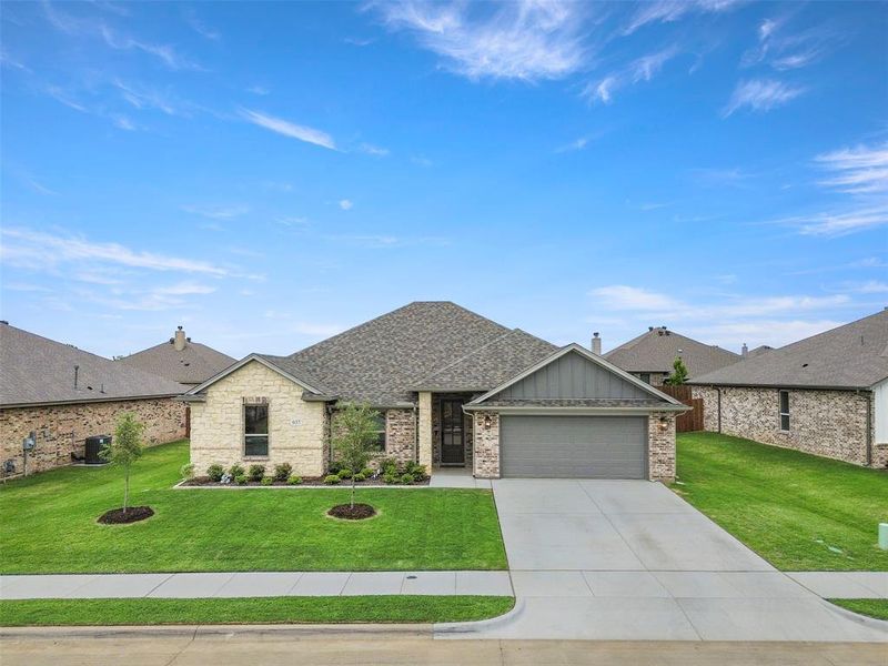 Front exterior of a new home in , Saginaw, TX, highlighting curb appeal (Image 21).