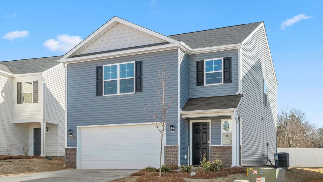 Front exterior of a new home in Chandler Pointe, Rural Hall, NC, highlighting curb appeal (Image 15).