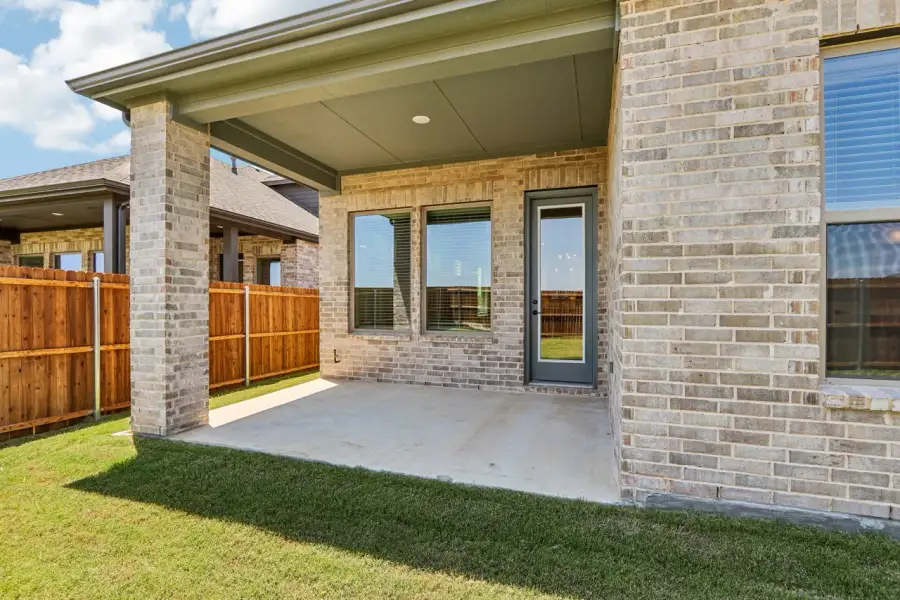 Exterior details and patio area of a home in Ribbonwood, Aubrey (Image 3).