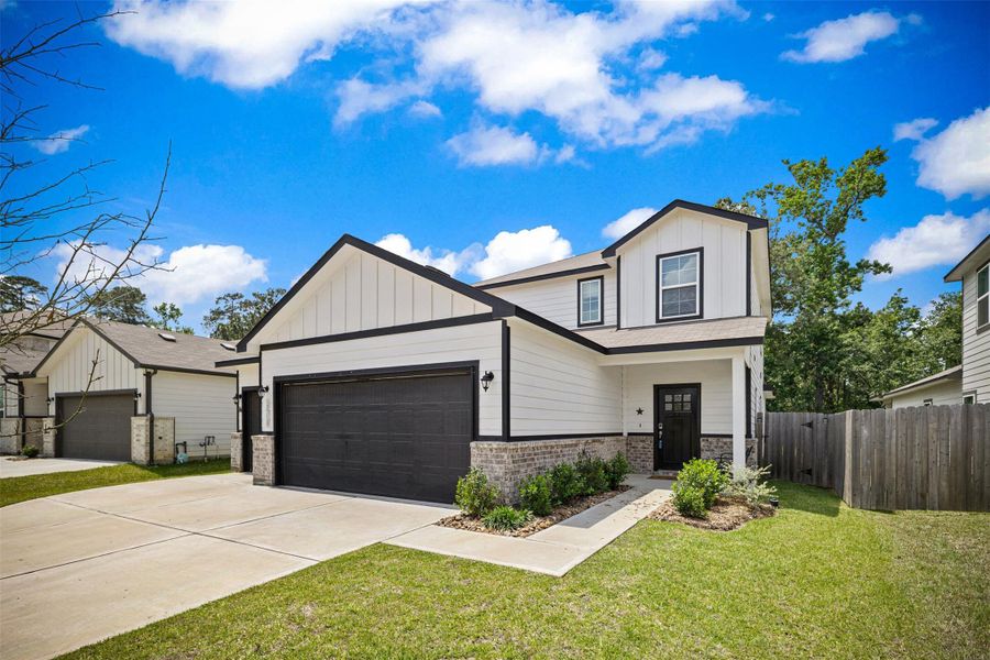 Front exterior of a new home in Liberty Collection at Fairway Farms, Tomball, TX, highlighting curb appeal (Image 1).