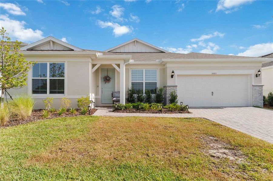Front exterior of a new home in Bridgewalk, St. Cloud, FL, highlighting curb appeal (Image 26). Front exterior of a new home in Bridgewalk, St. Cloud, FL, highlighting curb appeal (Image 26).