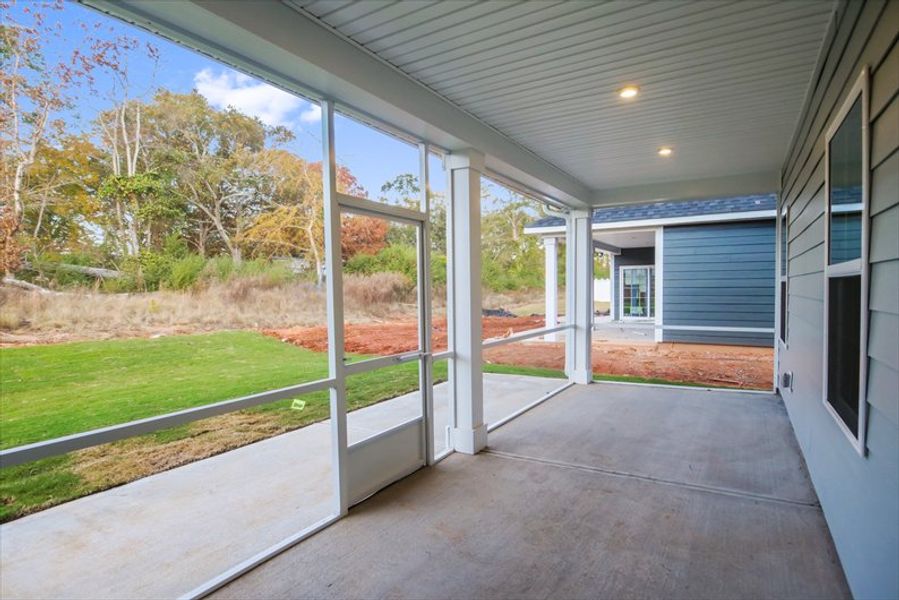 Exterior details and patio area of a home in Canterbrook Farms Ranches, Fountain Inn (Image 2).