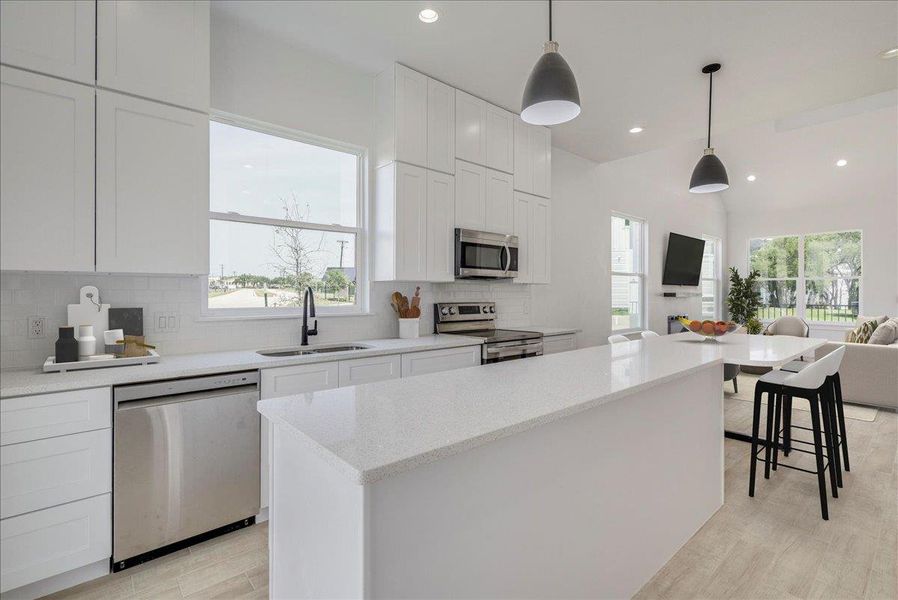 Open kitchen with eat in countertop Open kitchen with eat in countertop