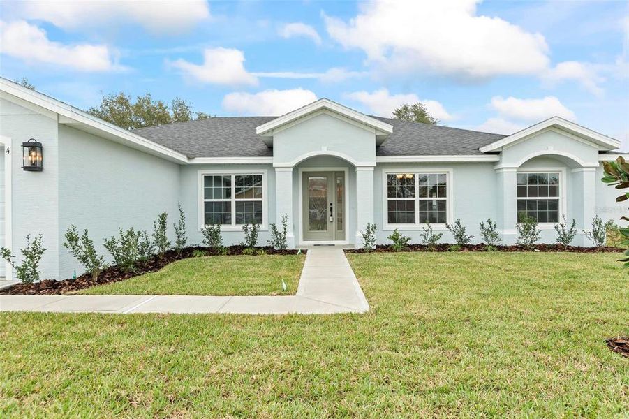 Front exterior of a new home in , Palm Coast, FL, highlighting curb appeal (Image 24).