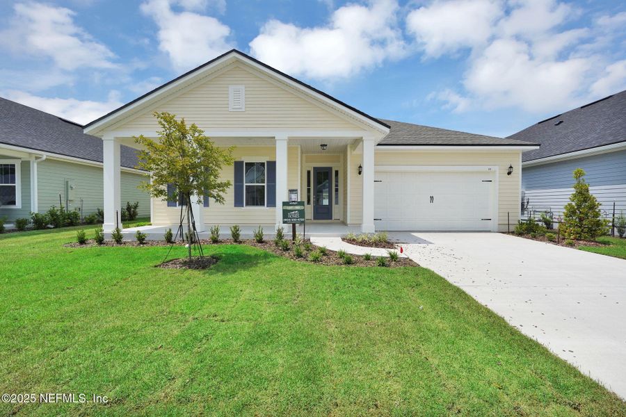 Front exterior of a new home in Forest Park at Wildlight, Yulee, FL, highlighting curb appeal (Image 21). Front exterior of a new home in Forest Park at Wildlight, Yulee, FL, highlighting curb appeal (Image 21).