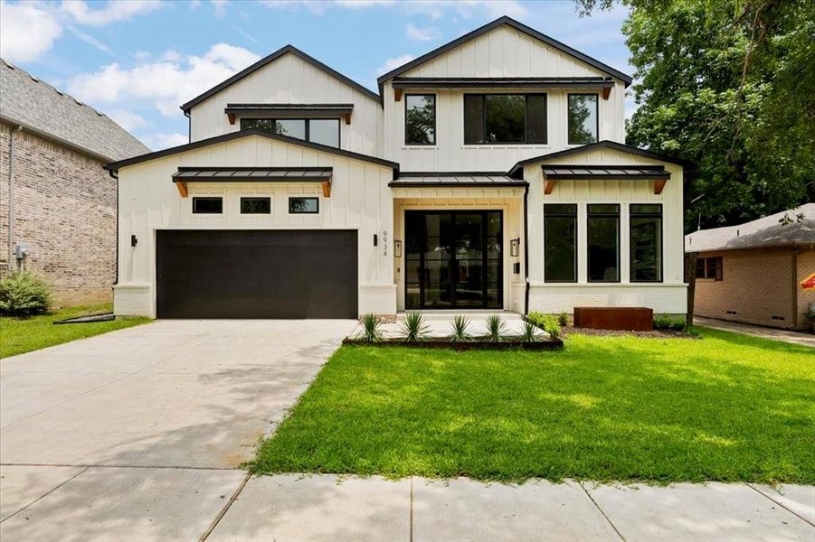 Modern inspired farmhouse featuring a front yard