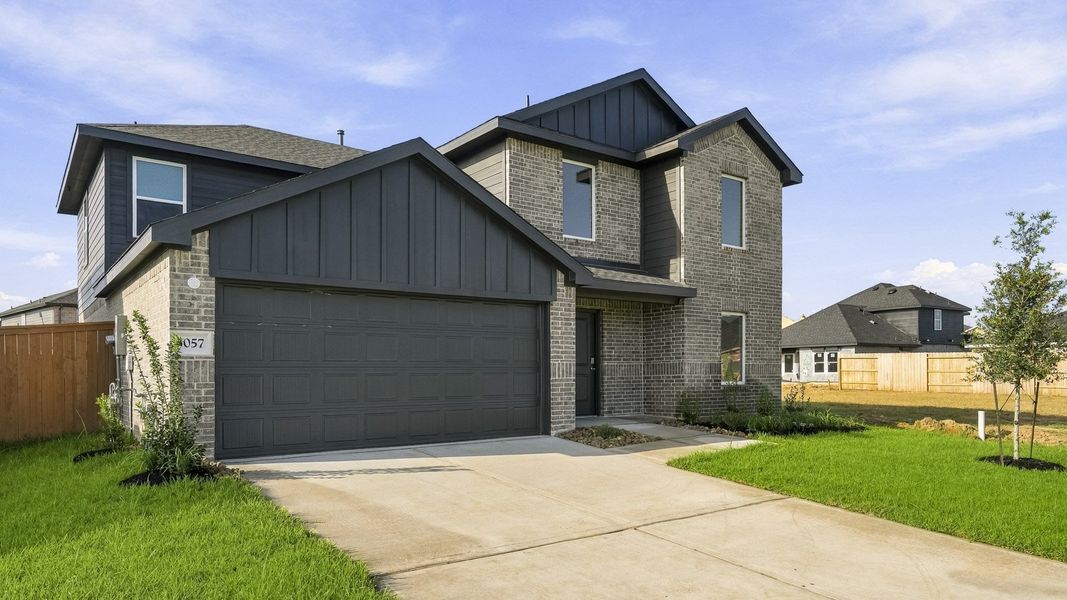 Front exterior of a new home in Sunterra, Katy, TX, highlighting curb appeal (Image 2). Front exterior of a new home in Sunterra, Katy, TX, highlighting curb appeal (Image 2).