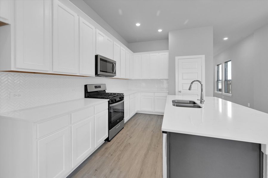 Furnished interior view inside a new home in Sunterra 40, Katy (Image 13).