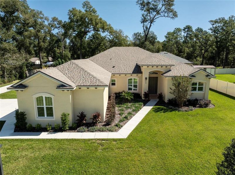Front exterior of a new home in , Orange City, FL, highlighting curb appeal (Image 19).