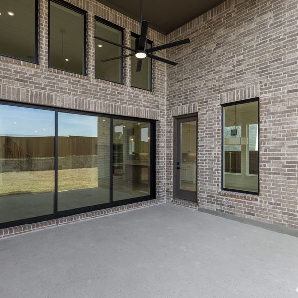 Exterior details and patio area of a home in Mosaic – 70′ Lots, Celina (Image 29).