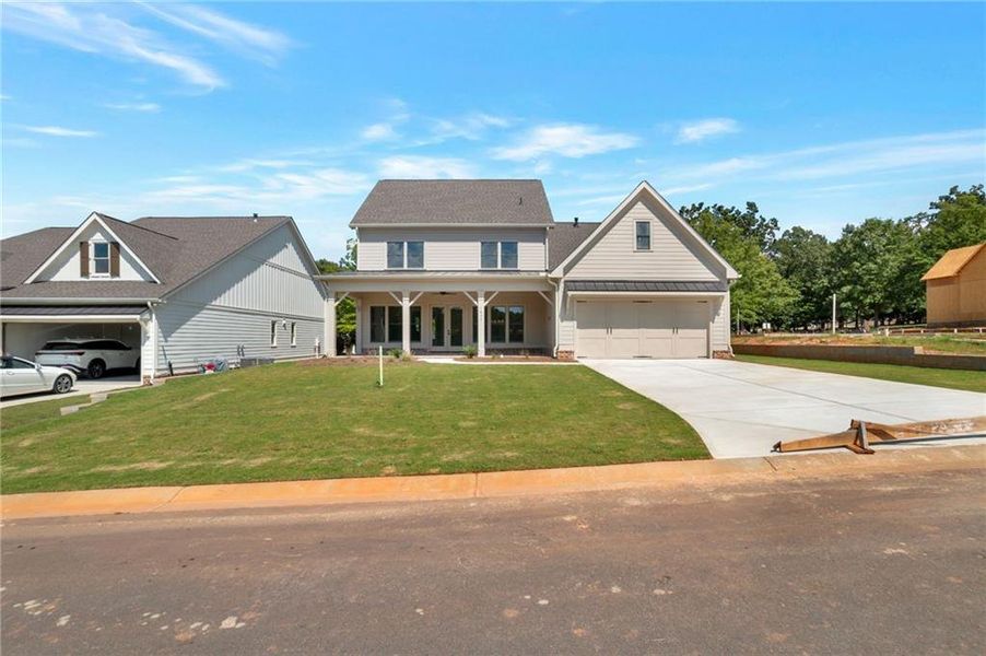Front exterior of a new home in , Statham, GA, highlighting curb appeal (Image 29).