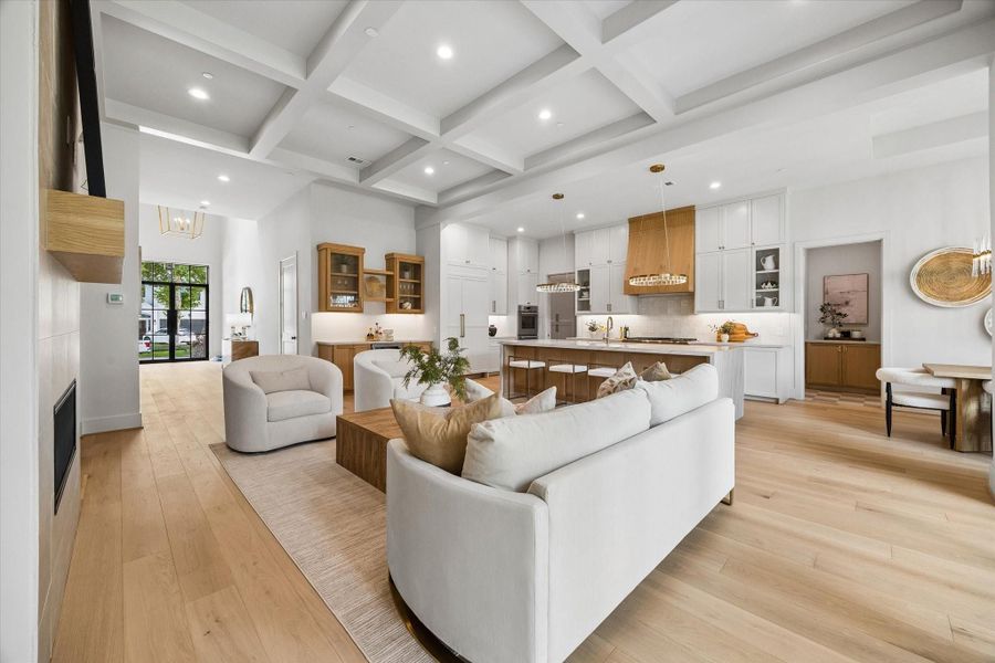 This angle of the living room captures the room’s warm wood floors and beamed ceiling, with the steel-and-glass front door just beyond adding light and architectural character. This angle of the living room captures the room’s warm wood floors and beamed ceiling, with the steel-and-glass front door just beyond adding light and architectural character.