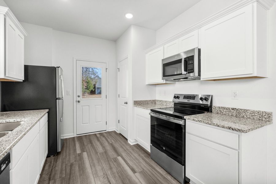 Furnished interior view inside a new home in Pender Woods at Cane Bay, Summerville (Image 4).