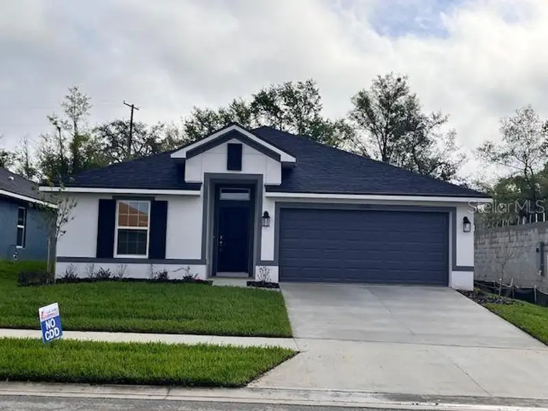 Front exterior of a new home in Abbey Glen, Dade City, FL, highlighting curb appeal (Image 1). Front exterior of a new home in Abbey Glen, Dade City, FL, highlighting curb appeal (Image 1).