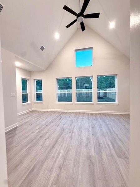 This is a true cathedral ceiling enhanced by the big windows & vinyl plank floors! This is a true cathedral ceiling enhanced by the big windows & vinyl plank floors!