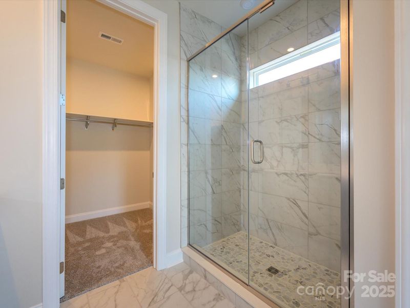 Primary Walk-In Shower With Oversized Modern Tile.