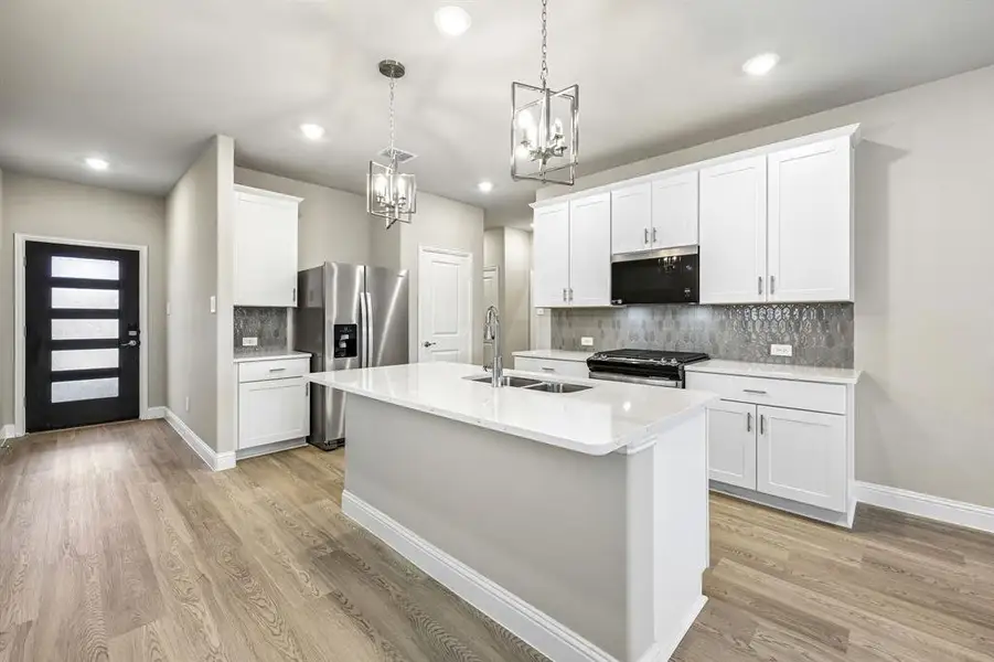 Furnished interior view inside a new home in Parks at Foster Crossing - Spring Series, Anna (Image 13).