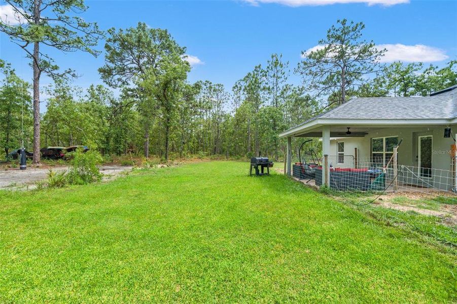 Exterior details and patio area of a home in Royal Highlands, Brooksville (Image 29).